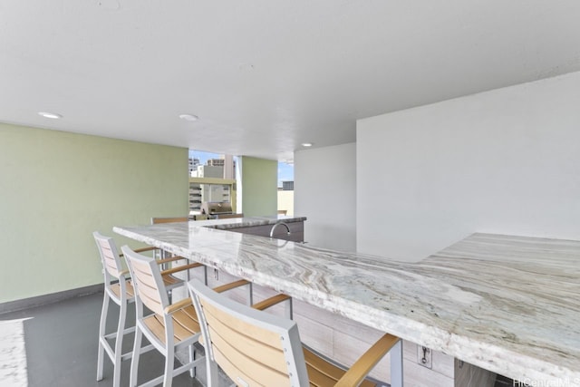 2452 Tusitala St Unit 1101, Honolulu, HI 96815 - indoor dry bar with finished concrete floors, baseboards, and recessed lighting