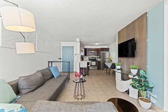 2452 Tusitala St Unit 1101, Honolulu, HI 96815 - living room with light tile patterned flooring and a textured ceiling