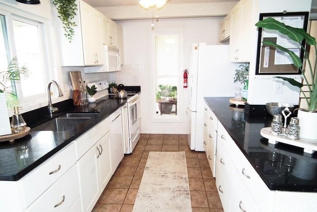 98-487 Kipaepae St Unit 116, Aiea, HI 96701 - kitchen with white appliances, a sink, healthy amount of natural light, and white cabinetry