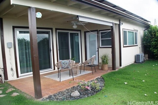 98-487 Kipaepae St Unit 116, Aiea, HI 96701 - back of house with a patio area, a lawn, and a ceiling fan