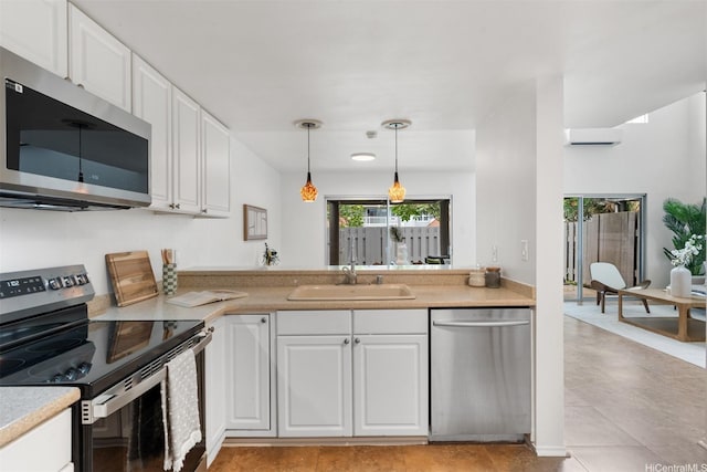 549 Keolu Dr Unit C, Kailua, HI 96734 - kitchen featuring appliances with stainless steel finishes, a sink, light countertops, and white cabinets