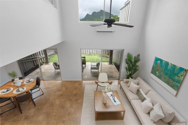 549 Keolu Dr Unit C, Kailua, HI 96734 - living room featuring a high ceiling, plenty of natural light, ceiling fan, and an AC wall unit