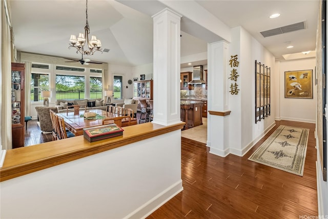 91-1338 Kaiokia St, Ewa Beach, HI 96706 - hall with a chandelier, dark wood finished floors, vaulted ceiling, and recessed lighting