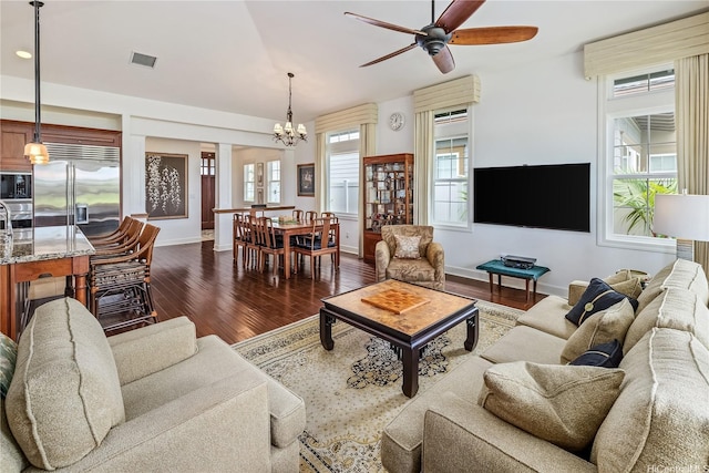 91-1338 Kaiokia St, Ewa Beach, HI 96706 - living area featuring a chandelier, a ceiling fan, dark wood finished floors, plenty of natural light, and vaulted ceiling