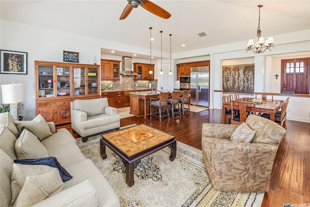 91-1338 Kaiokia St, Ewa Beach, HI 96706 - living room with dark wood-style flooring, a ceiling fan, a chandelier, and recessed lighting