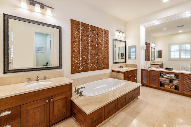 91-1338 Kaiokia St, Ewa Beach, HI 96706 - bathroom with two vanities, a garden tub, tile patterned flooring, and recessed lighting
