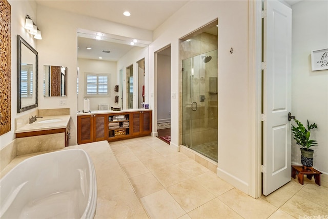 91-1338 Kaiokia St, Ewa Beach, HI 96706 - full bath featuring a shower stall, vanity, tile patterned floors, a bath, and recessed lighting