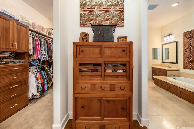 91-1338 Kaiokia St, Ewa Beach, HI 96706 - full bathroom with vanity, a garden tub, and a walk in closet