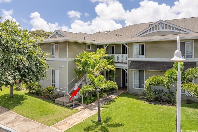 91-1058 Kekuilani Loop Unit 1605, Kapolei, HI 96707 - view of front facade with a front yard and a shingled roof