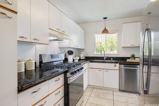 91-1058 Kekuilani Loop Unit 1605, Kapolei, HI 96707 - kitchen with appliances with stainless steel finishes, under cabinet range hood, a sink, and dark stone countertops