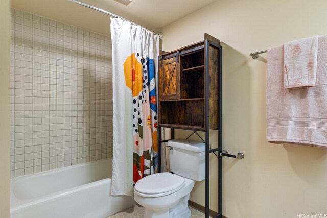 5070 Likini St Unit 1409, Honolulu, HI 96818 - bathroom with shower / bath combo with shower curtain, toilet, and tile patterned flooring