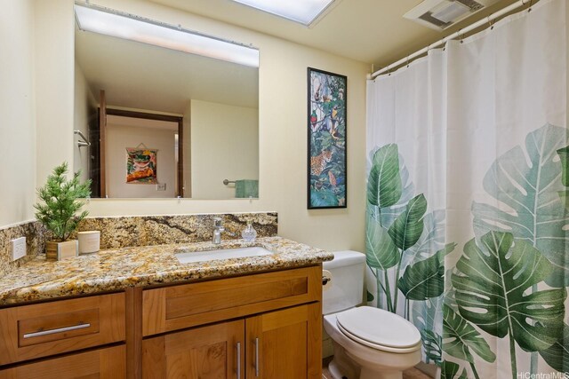 5070 Likini St Unit 1409, Honolulu, HI 96818 - full bathroom with vanity and toilet