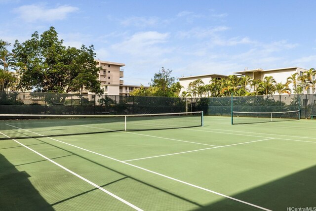 5070 Likini St Unit 1409, Honolulu, HI 96818 - view of tennis court featuring fence and community basketball court