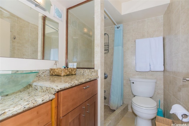 1700 Ala Moana Blvd Unit 1601, Honolulu, HI 96815 - full bath featuring tile walls, a tile shower, vanity, toilet, and tile patterned flooring