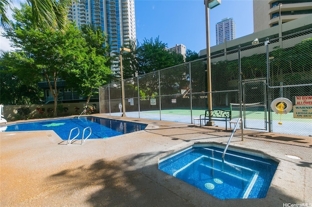 1700 Ala Moana Blvd Unit 1601, Honolulu, HI 96815 - community pool featuring a gate, fence, a hot tub, and a patio