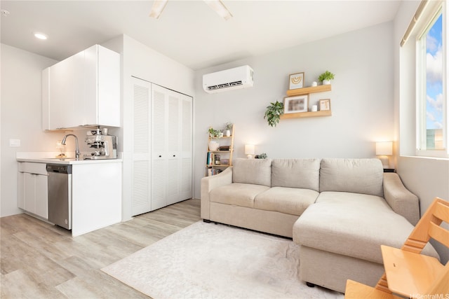 91-3575 Kamolehonua St Unit 1413, Ewa Beach, HI 96706 - living room featuring an AC wall unit, light wood finished floors, and recessed lighting
