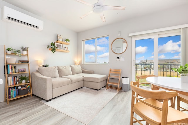 91-3575 Kamolehonua St Unit 1413, Ewa Beach, HI 96706 - living room featuring a wall mounted air conditioner, light wood-type flooring, plenty of natural light, and a ceiling fan