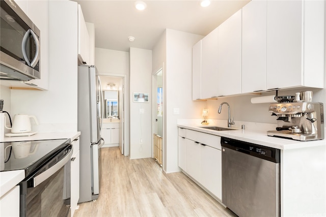 91-3575 Kamolehonua St Unit 1413, Ewa Beach, HI 96706 - kitchen with appliances with stainless steel finishes, a sink, light wood-type flooring, light countertops, and recessed lighting