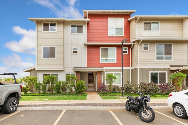 91-3575 Kamolehonua St Unit 1413, Ewa Beach, HI 96706 - view of property featuring board and batten siding and uncovered parking