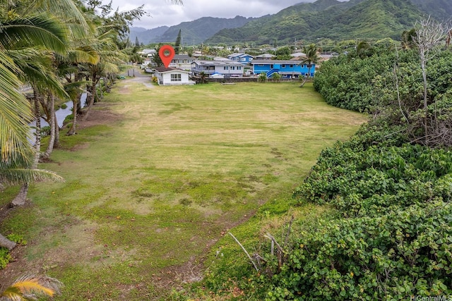 54-011 Waikulama St, Hauula, HI 96717 - view of green lawn featuring a mountain view