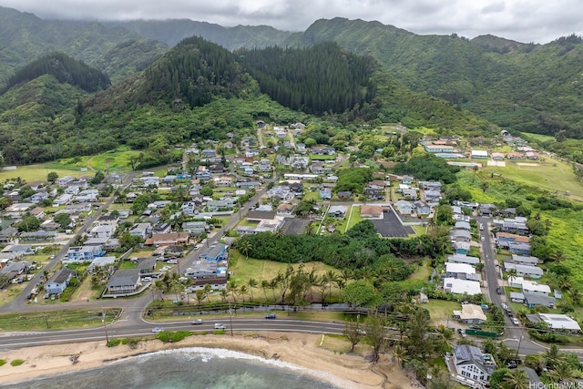 54-011 Waikulama St, Hauula, HI 96717 - aerial view of property's location with a mountain backdrop and nearby suburban area