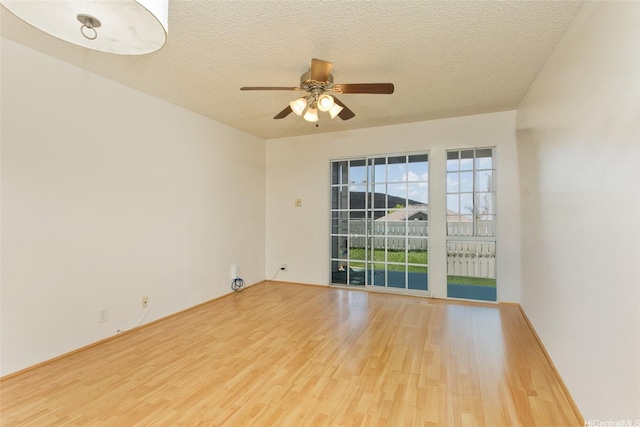 92-1045 Lalahi St Unit 102, Kapolei, HI 96707 - unfurnished room featuring wood finished floors, a ceiling fan, and a textured ceiling