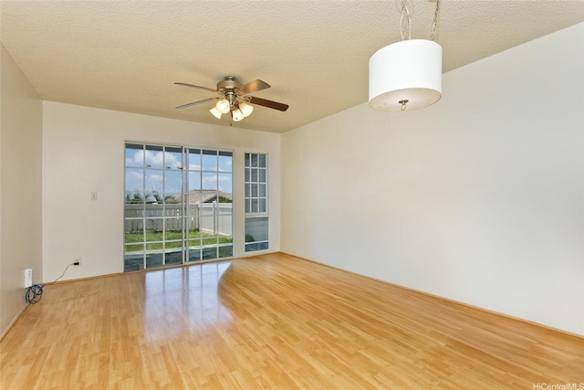 92-1045 Lalahi St Unit 102, Kapolei, HI 96707 - spare room featuring wood finished floors, ceiling fan, and a textured ceiling