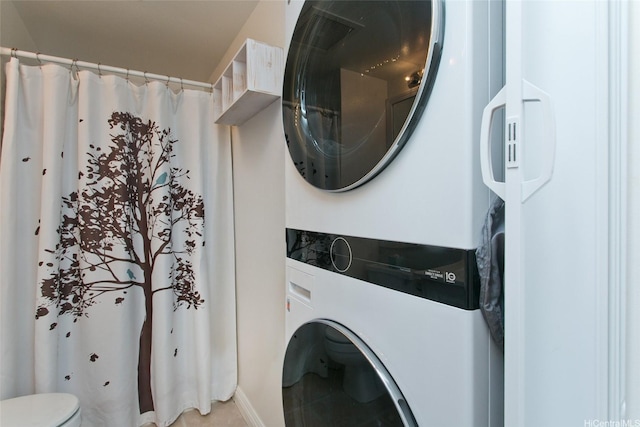 92-1045 Lalahi St Unit 102, Kapolei, HI 96707 - laundry room with stacked washing machine and dryer and light tile patterned floors