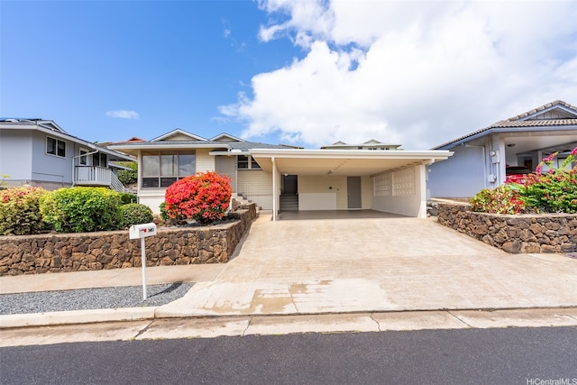 3483 Ala Hinalo St, Honolulu, HI 96818 - view of front facade featuring concrete driveway and a carport