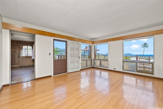 748 Ocean View Dr, Honolulu, HI 96816 - spare room with baseboards, healthy amount of natural light, light wood-style floors, and ornamental molding