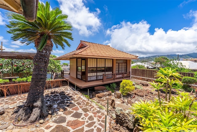 748 Ocean View Dr, Honolulu, HI 96816 - rear view of property featuring a fenced backyard, a tile roof, and a deck with mountain view