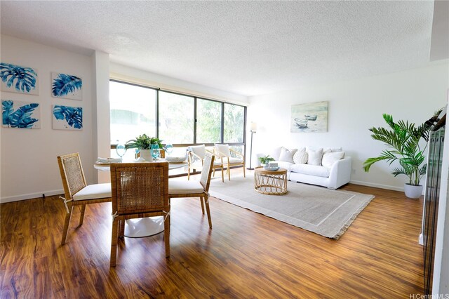217 Prospect St Unit A14, Honolulu, HI 96813 - dining space with a textured ceiling and wood finished floors
