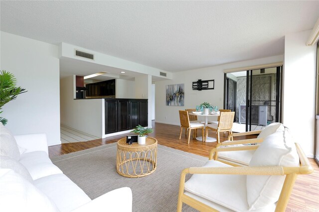 217 Prospect St Unit A14, Honolulu, HI 96813 - living area with light wood-style flooring and a textured ceiling