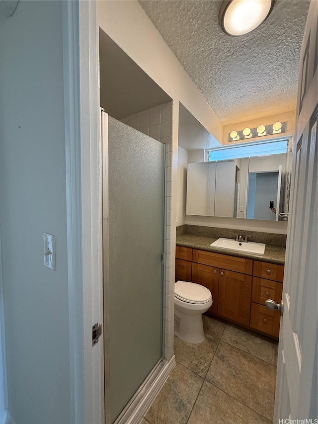 2575 Kuhio Ave Unit 1402, Honolulu, HI 96815 - full bath with a shower stall, vanity, toilet, tile patterned floors, and a textured ceiling