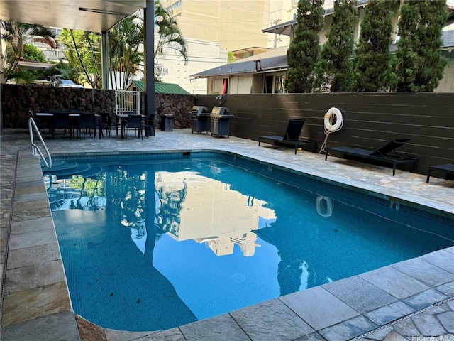 2575 Kuhio Ave Unit 1402, Honolulu, HI 96815 - view of pool with a patio and area for grilling