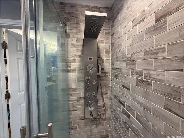 bathroom with a tile shower