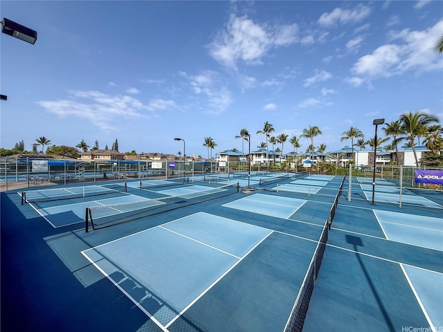 view of tennis court with fence