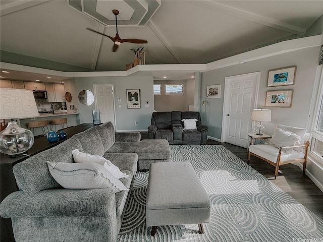 living room with wood finished floors, a ceiling fan, baseboards, high vaulted ceiling, and recessed lighting