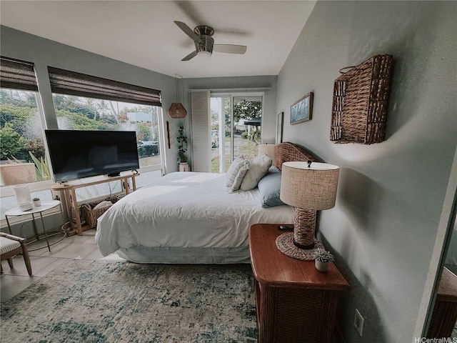 tiled bedroom featuring a ceiling fan