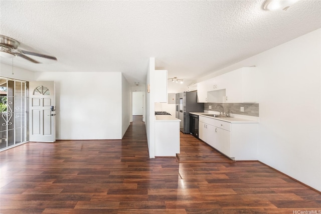 91-1099 Puamaeole St Unit 17U, Ewa Beach, HI 96706 - kitchen with a sink, light countertops, black dishwasher, a ceiling fan, and dark wood-style flooring
