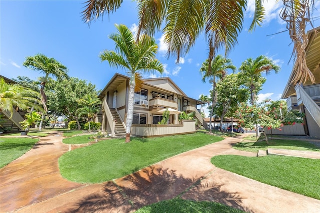 91-1099 Puamaeole St Unit 17U, Ewa Beach, HI 96706 - view of property's community with stairs and a yard