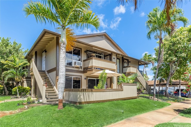 91-1099 Puamaeole St Unit 17U, Ewa Beach, HI 96706 - view of building exterior with stairway and cooling unit