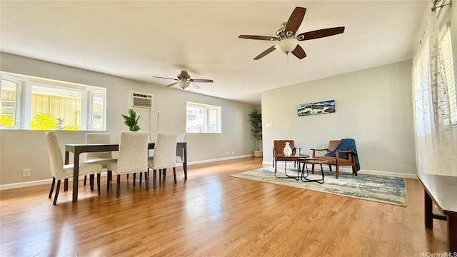 739 Kinalau Pl Unit 1, Honolulu, HI 96813 - dining area with light wood finished floors, a wall unit AC, and a ceiling fan