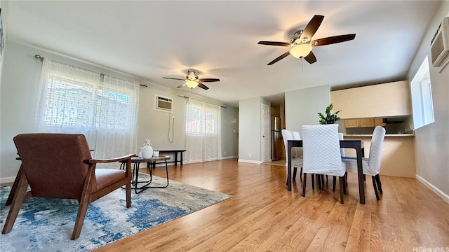 739 Kinalau Pl Unit 1, Honolulu, HI 96813 - dining area featuring ceiling fan, light wood finished floors, baseboards, and a wall mounted AC