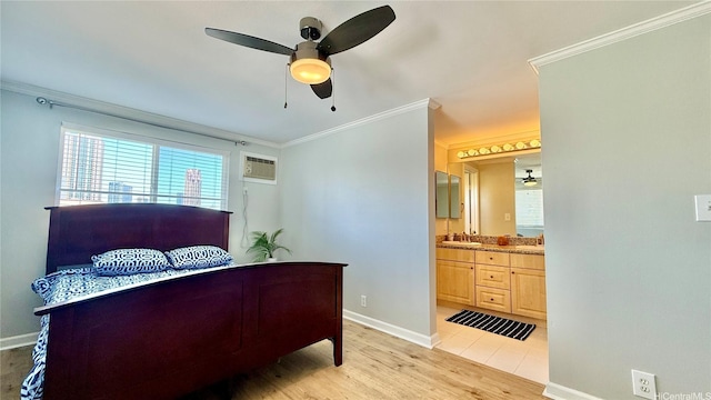 739 Kinalau Pl Unit 1, Honolulu, HI 96813 - bedroom featuring crown molding, a sink, baseboards, light wood-style floors, and ensuite bath