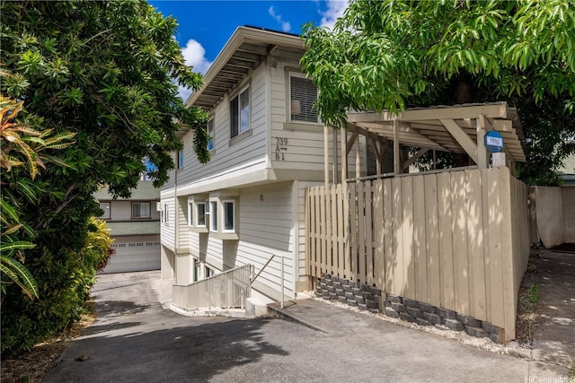 739 Kinalau Pl Unit 1, Honolulu, HI 96813 - view of side of property featuring a garage and driveway