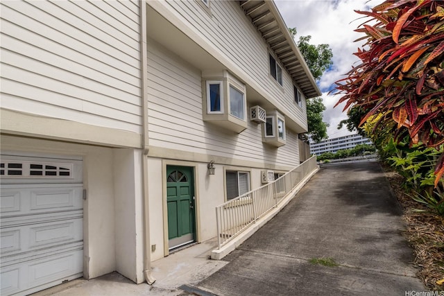 739 Kinalau Pl Unit 1, Honolulu, HI 96813 - view of side of home with a garage and stucco siding