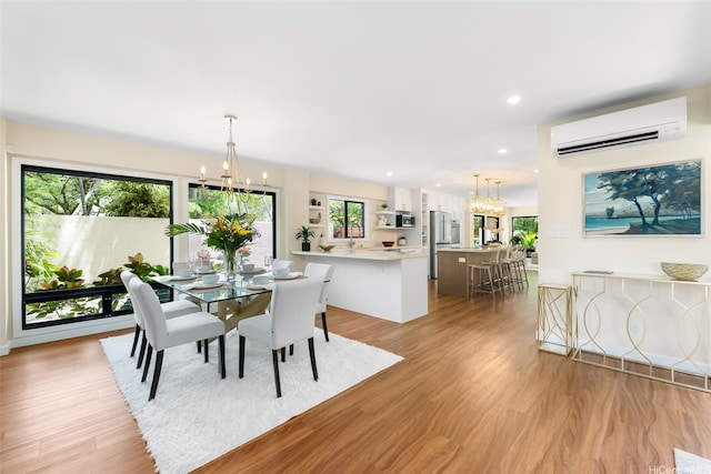 3002 Diamond Head Rd, Honolulu, HI 96815 - dining room featuring a wall mounted AC, a chandelier, light wood-style flooring, and recessed lighting