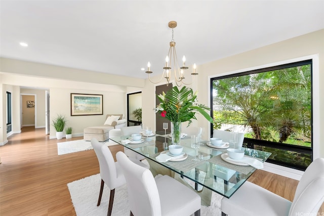 3002 Diamond Head Rd, Honolulu, HI 96815 - dining area featuring wood finished floors, a chandelier, baseboards, and recessed lighting