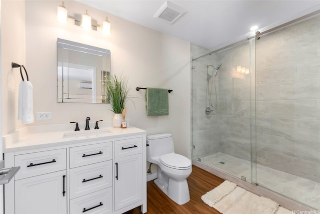 3002 Diamond Head Rd, Honolulu, HI 96815 - full bath featuring a shower stall, toilet, wood finished floors, and vanity